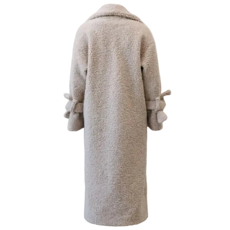 Beige teddy coat on a white background