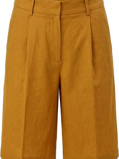 Mustard yellow shorts with a brand label on a white background
