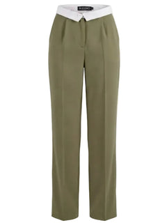 Olive green pants with a white shirt underneath on a light gray background