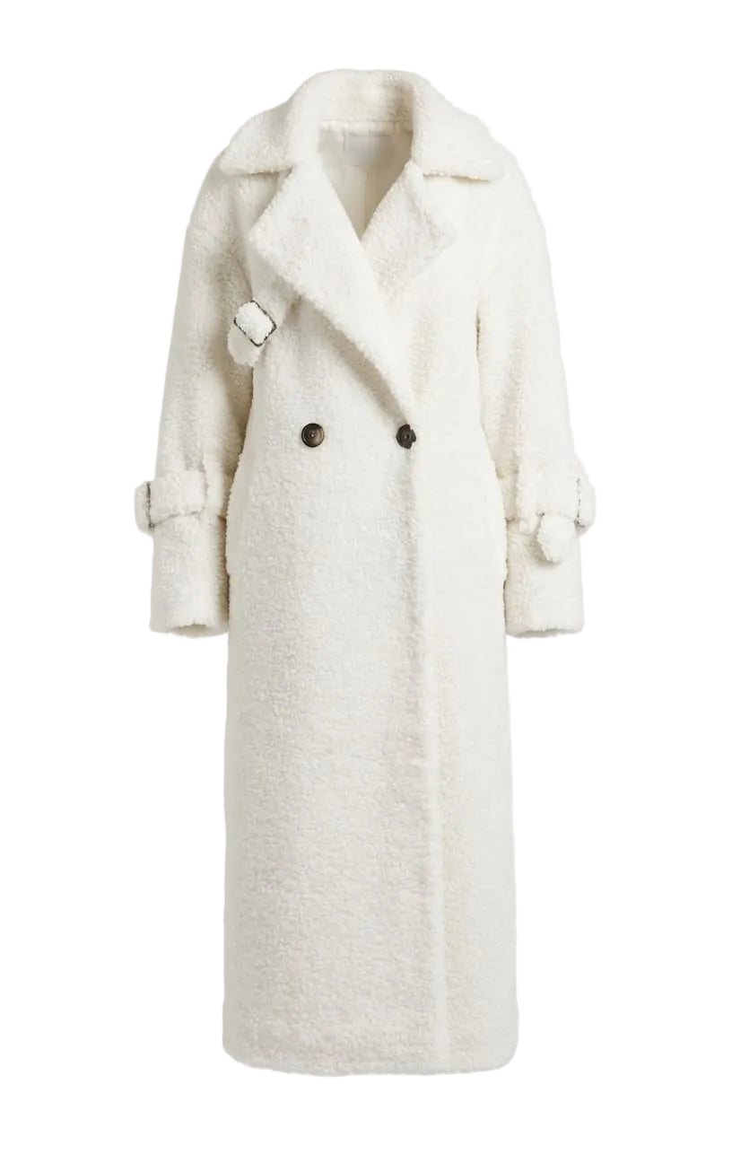 White coat with black buttons on a light gray background