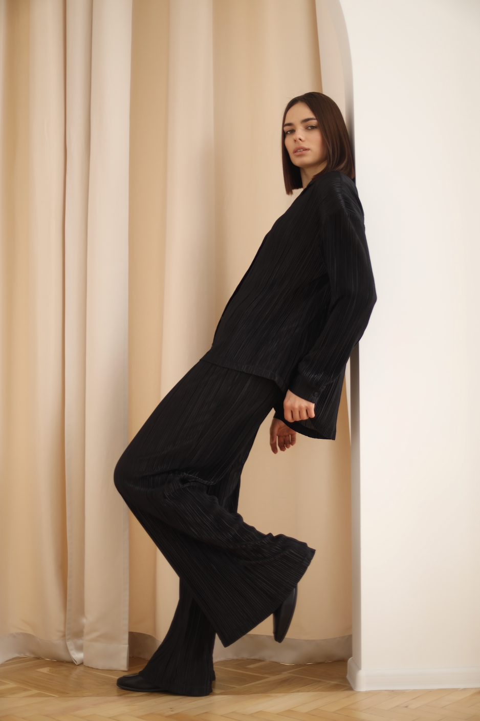 black pleated shirt