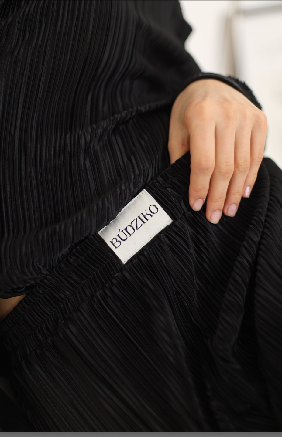black pleated shirt